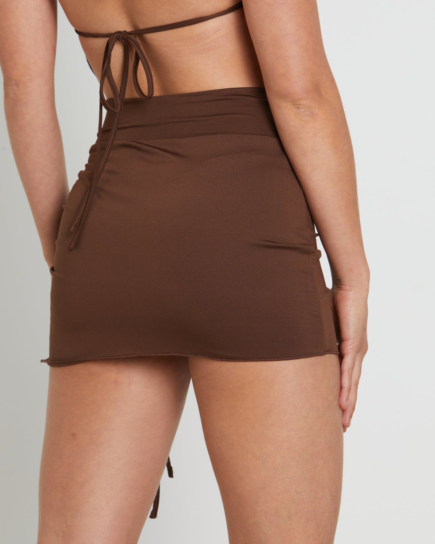 Amity Asymmetric Hem Ruched Mini Skirt in Brown