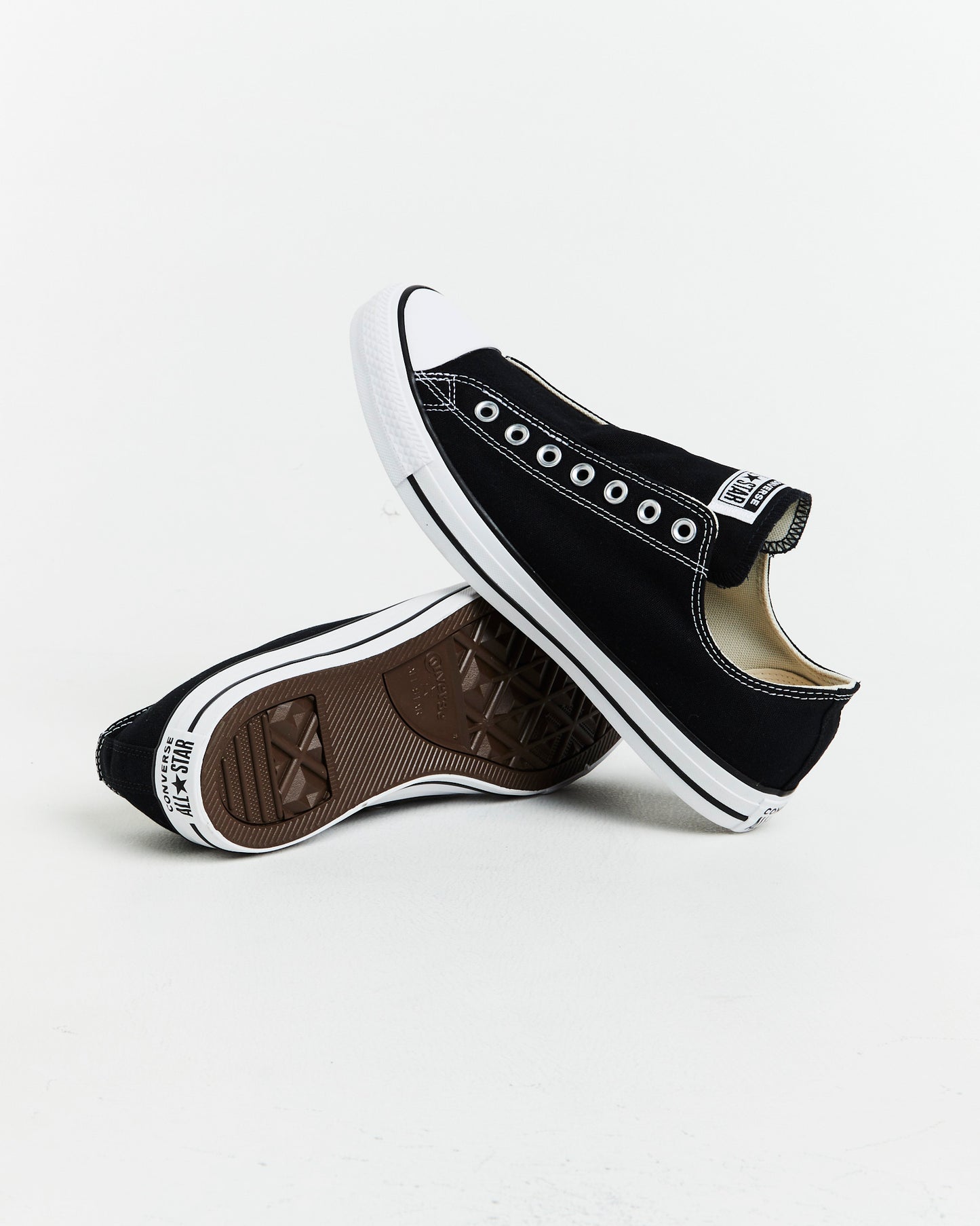 Chuck Taylor All Star Slip On Sneakers In Black/White